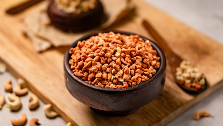 Cashew Pralines 2 A bowl filled with caramelized praline pieces used as ice cream toppings.
