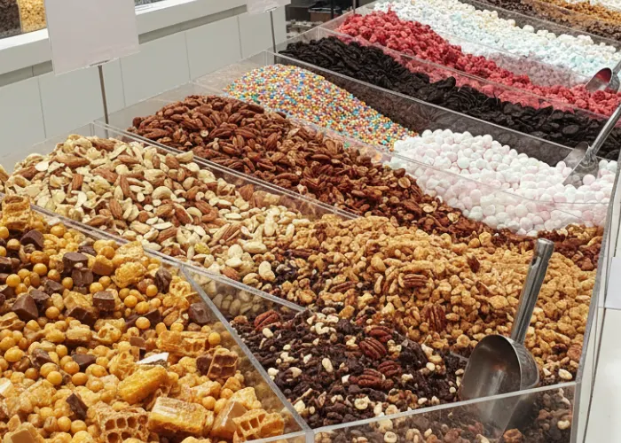 Ice cream toppings like Golden Fantasy and Mix Nut Crunch displayed for bulk buyers and manufacturers.